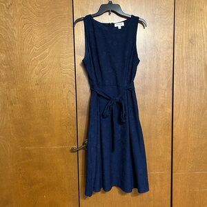 Like new! Wore once. Navy blue sleeveless belted dress size L GORGEOUS.